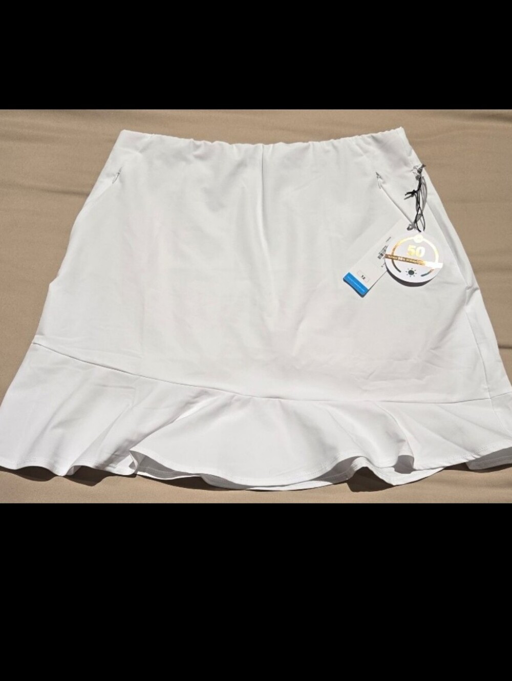 NWT! Tail Allure flounce skort. Attached shorts. Pull on White. Size 12. UPF 50+
